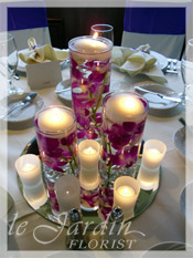 Wedding Centerpieces with Orchids and Votive Candles