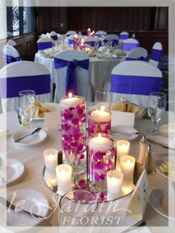 Wedding Centerpieces with Orchids and Votive Candles